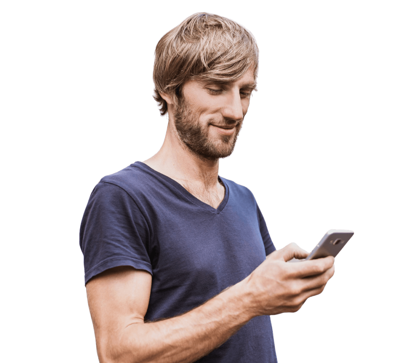 Man with a beard wearing a navy t-shirt, smiling while using a smartphone.