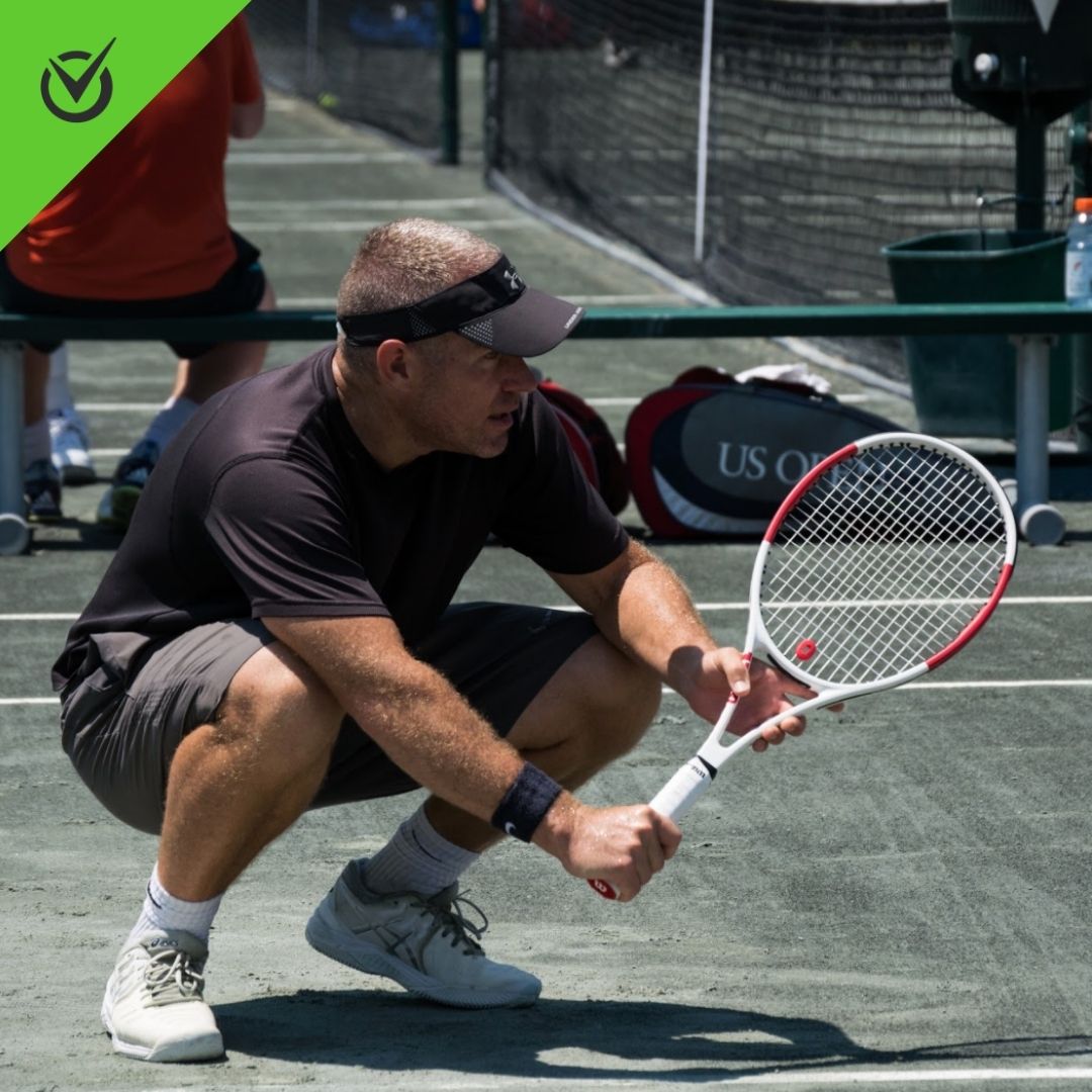 Photo of Hollow Rock Racquet and Swim Club player stretching for upcoming tennis match