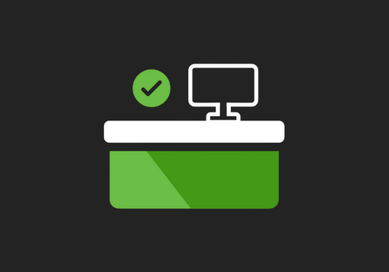 Computer monitor on desk with green check mark